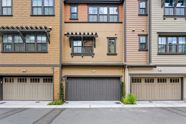 a kitchen with stainless steel appliances a sink stove and refrigerator