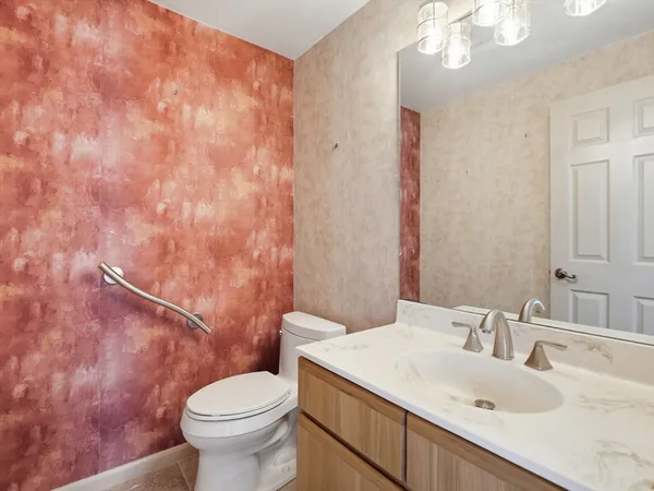 a bathroom with a sink and a toilet