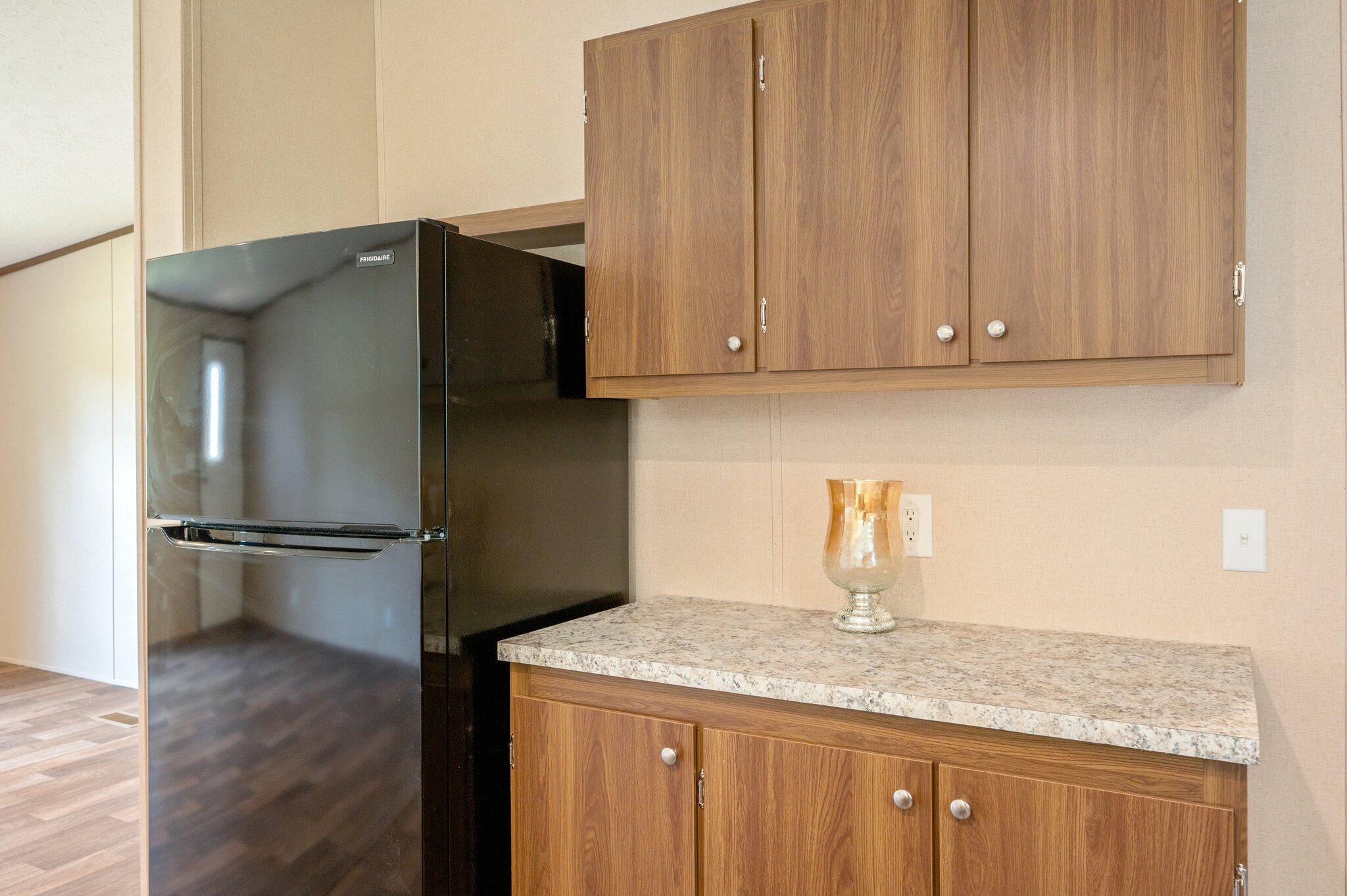 5227 Richardson Road Crestview, FL 32539 - Photo 15 of 44 a kitchen with a refrigerator sink and cabinets