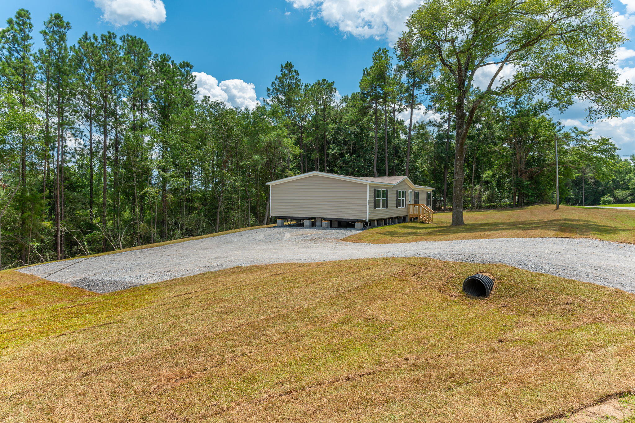 5227 Richardson Road Crestview, FL 32539 - Photo 2 of 44 a view of a swimming pool with an outdoor space and seating area
