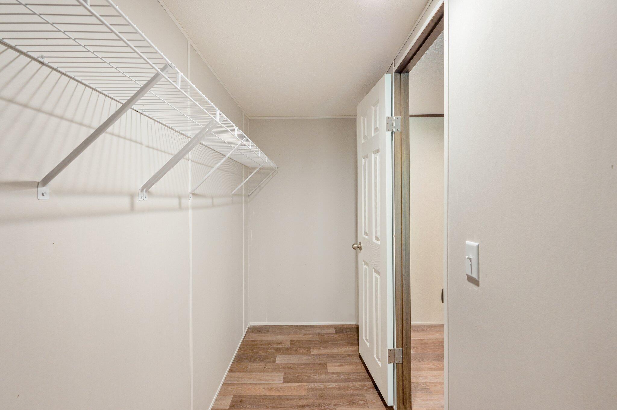 5227 Richardson Road Crestview, FL 32539 - Photo 24 of 44 a view of a hallway with wooden floor and entryway