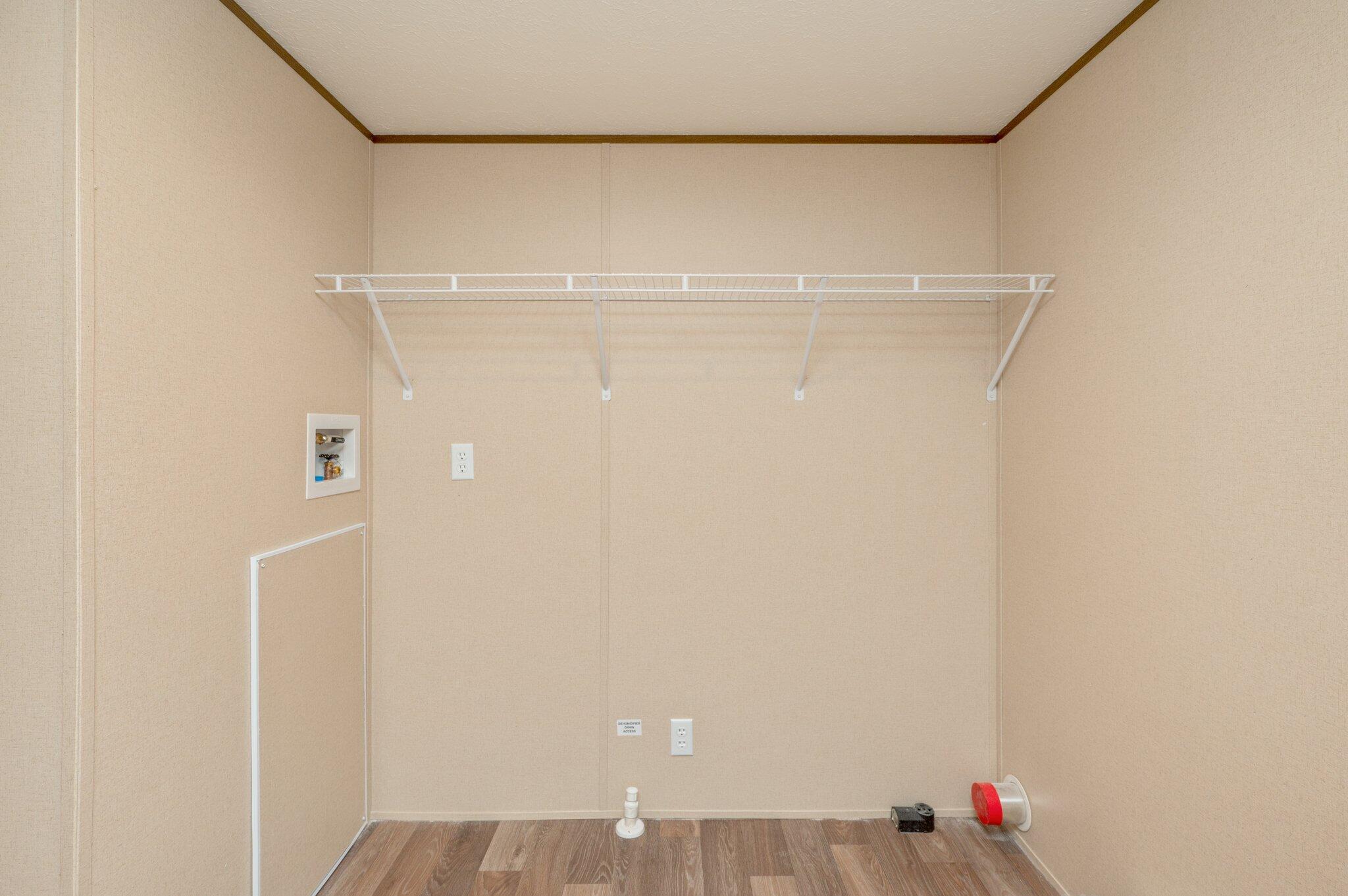 5227 Richardson Road Crestview, FL 32539 - Photo 35 of 44 a view of small space with racks on the wall