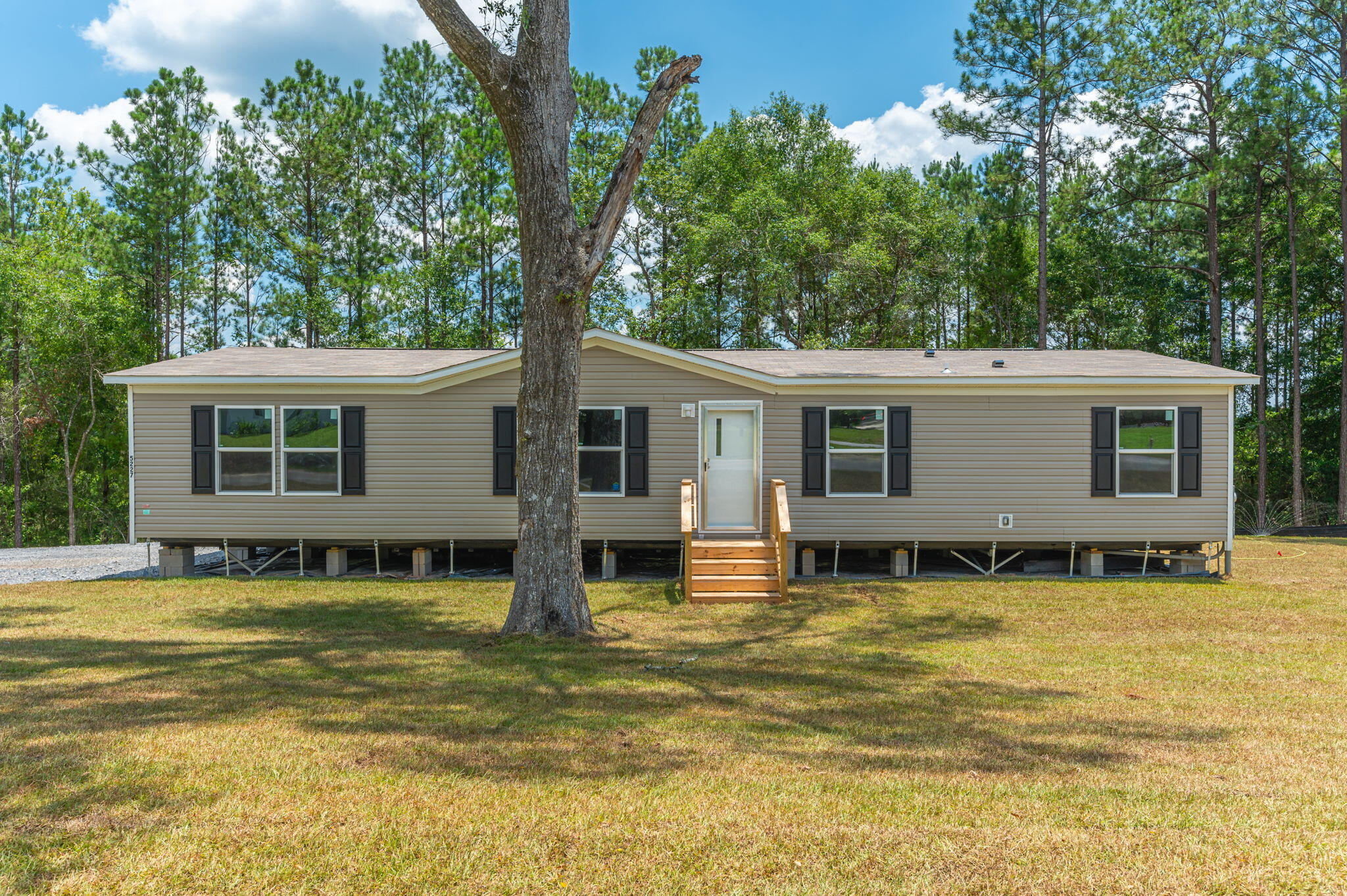 5227 Richardson Road Crestview, FL 32539 - Photo 5 of 44 a view of a house with a swimming pool