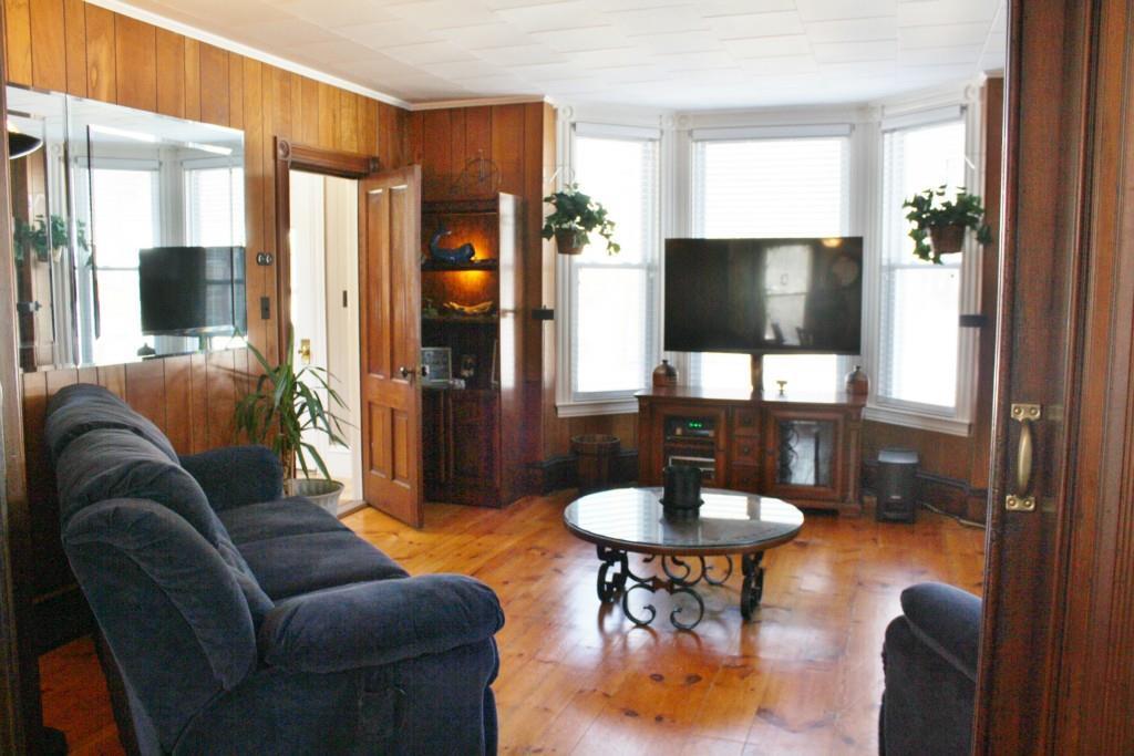 67 Pleasant Street Springvale, ME 04083 - Photo 21 of 35 Living room with wide pine floors...