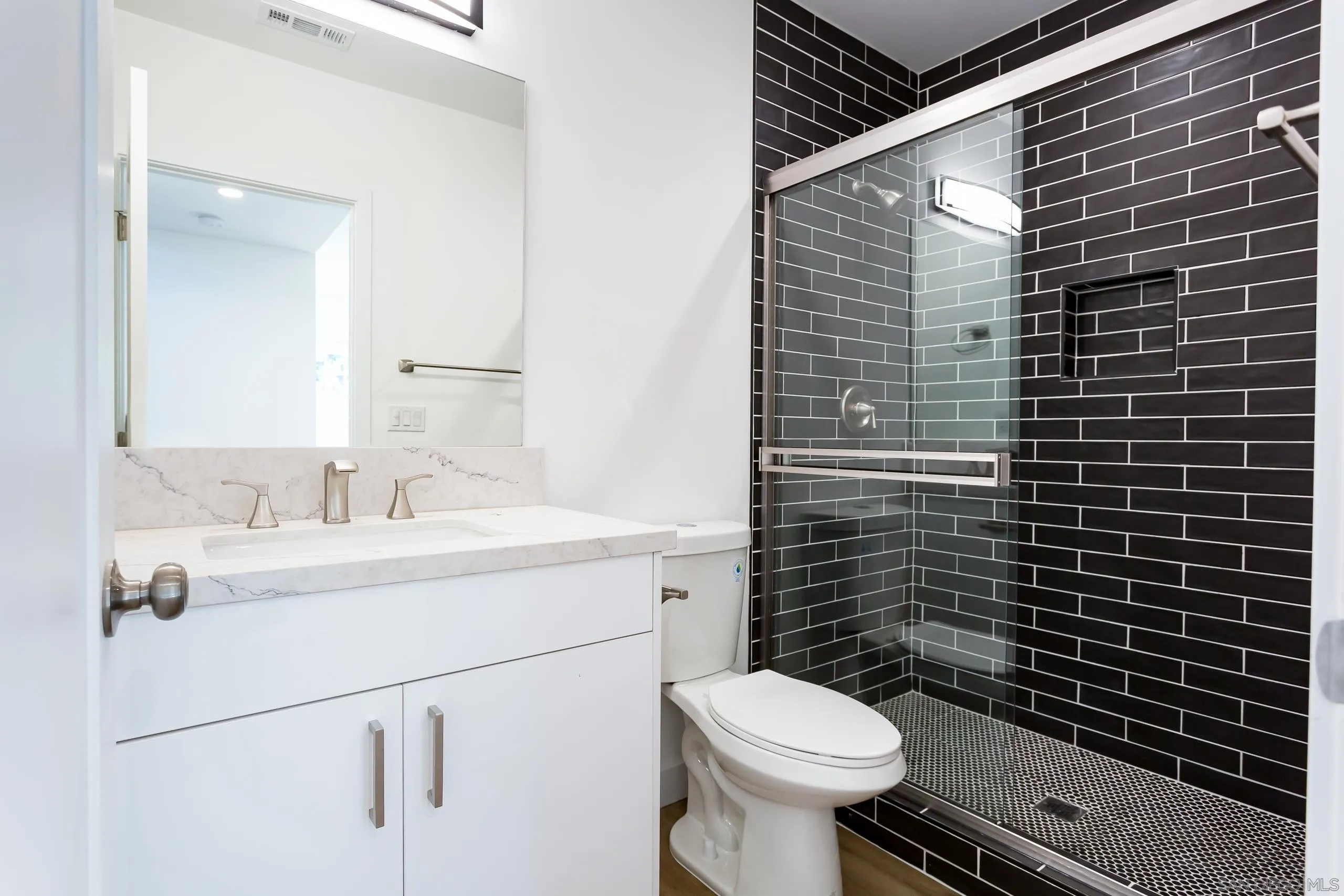 5721-23 Campanile Way San Diego, CA 92115 - Photo 17 of 59 a bathroom with a sink toilet and mirror