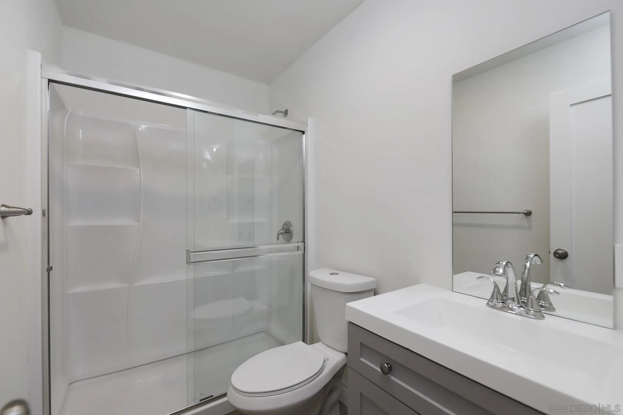 5721-23 Campanile Way San Diego, CA 92115 - Photo 27 of 59 a bathroom with a sink toilet and shower