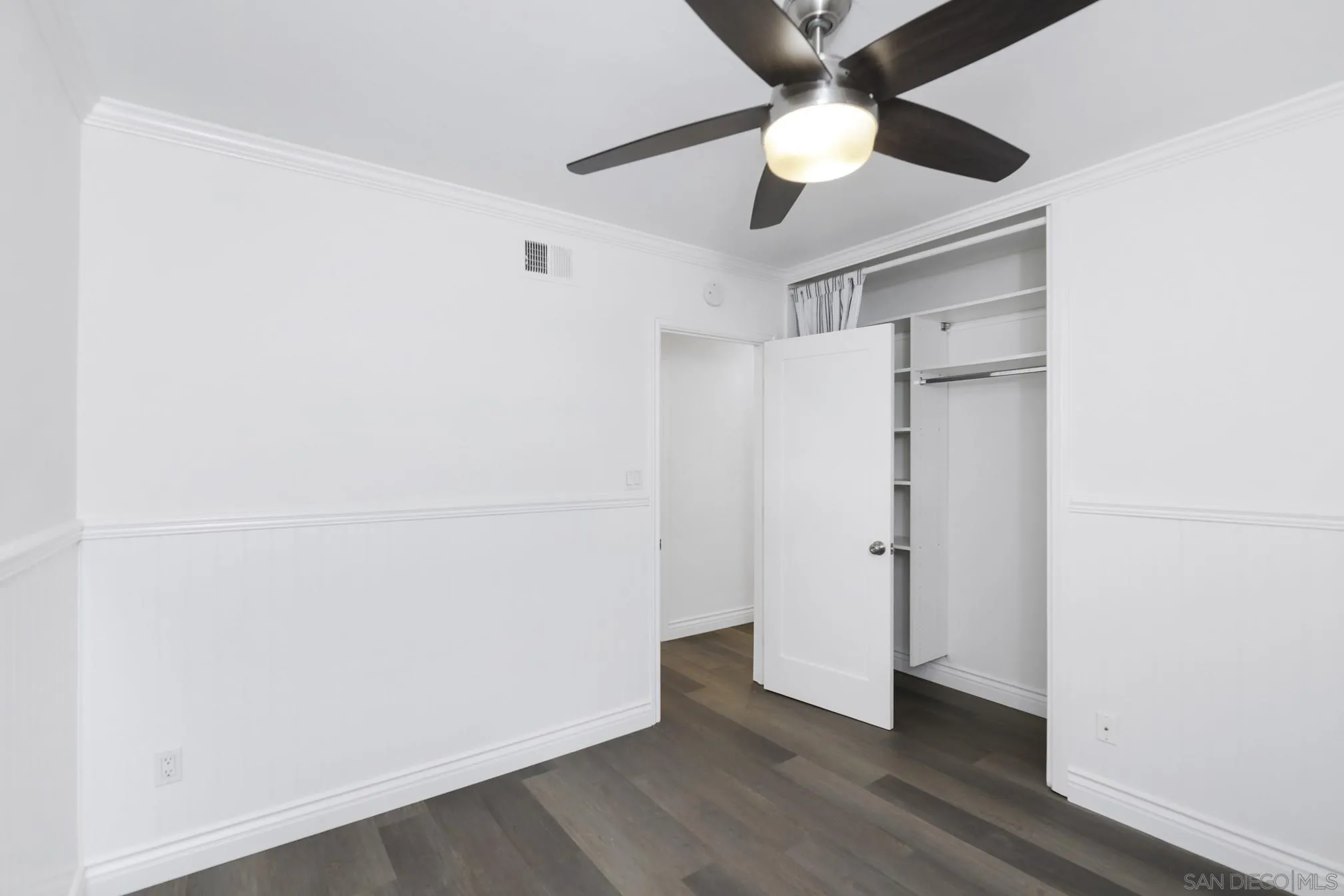 5721-23 Campanile Way San Diego, CA 92115 - Photo 34 of 59 an empty room with wooden floor