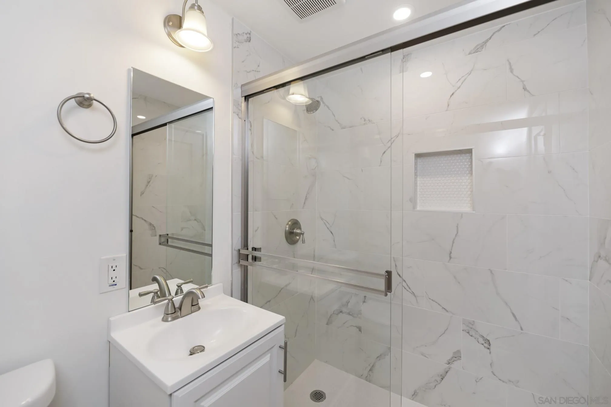 5721-23 Campanile Way San Diego, CA 92115 - Photo 35 of 59 a bathroom with a sink toilet and shower