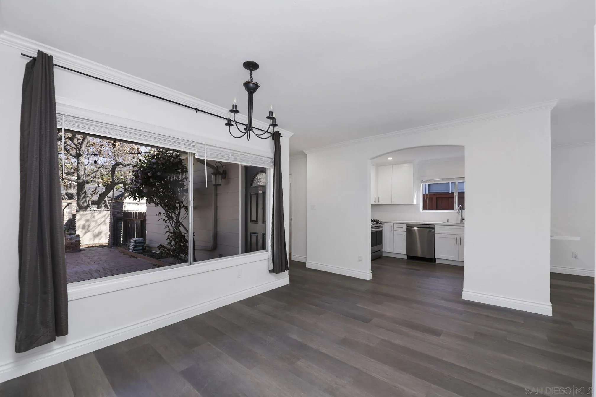 5721-23 Campanile Way San Diego, CA 92115 - Photo 38 of 59 a view of a room with wooden floor portable swimming pool and windows