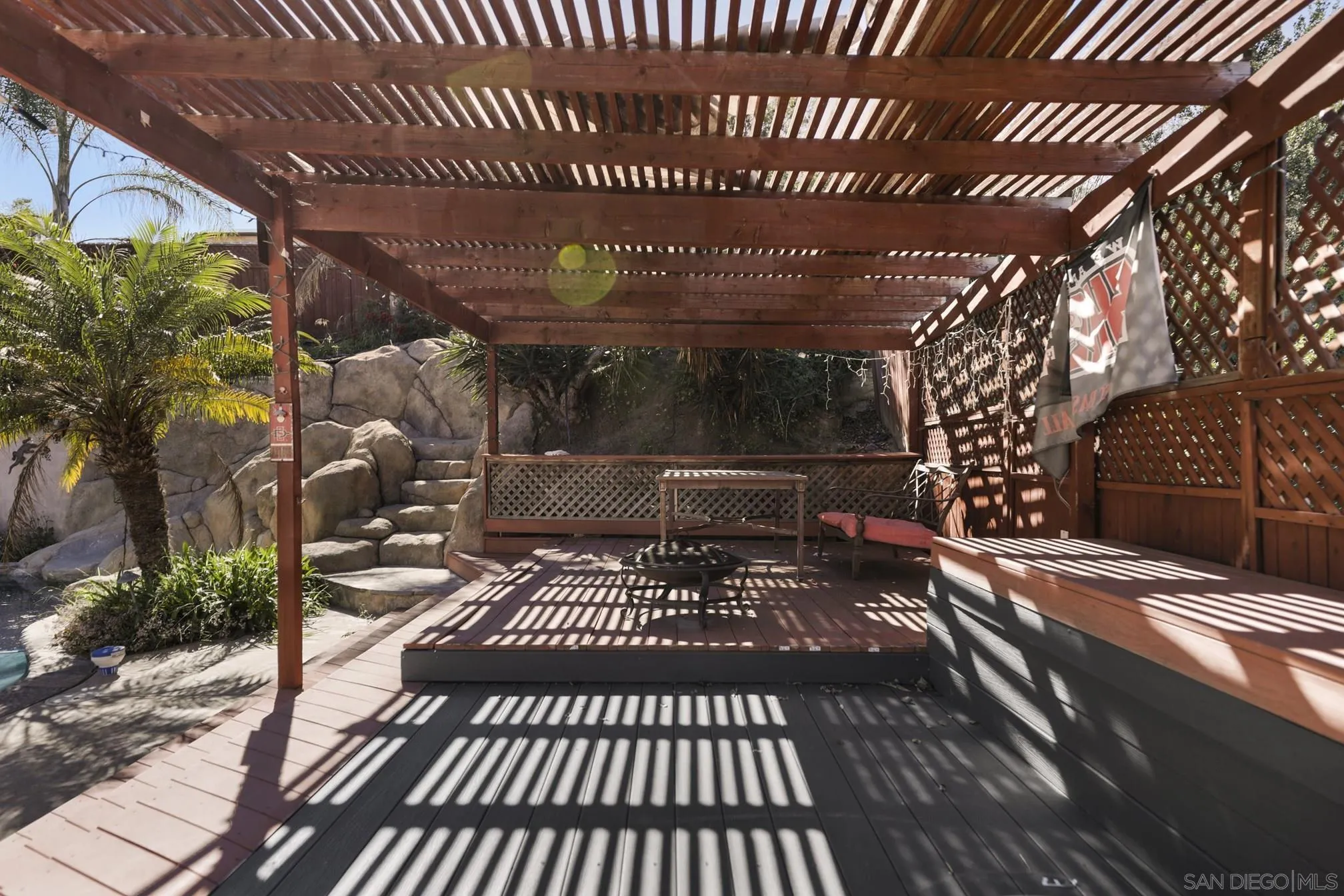 5721-23 Campanile Way San Diego, CA 92115 - Photo 51 of 59 a view of a patio with table and chairs and wooden floor