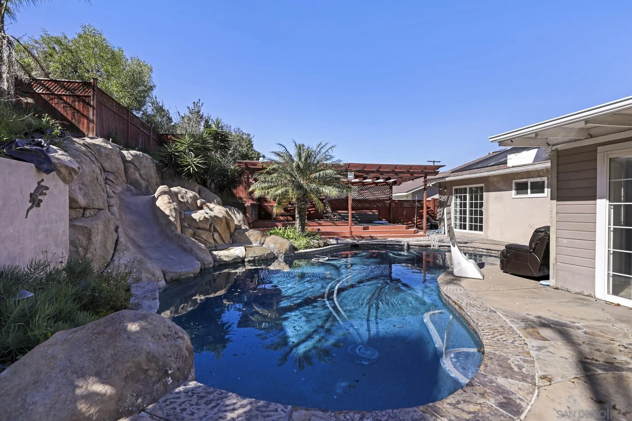 5721-23 Campanile Way San Diego, CA 92115 - Photo 54 of 59 a view of a house with backyard porch and sitting area