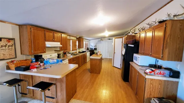 a very nice looking dining room with a large window