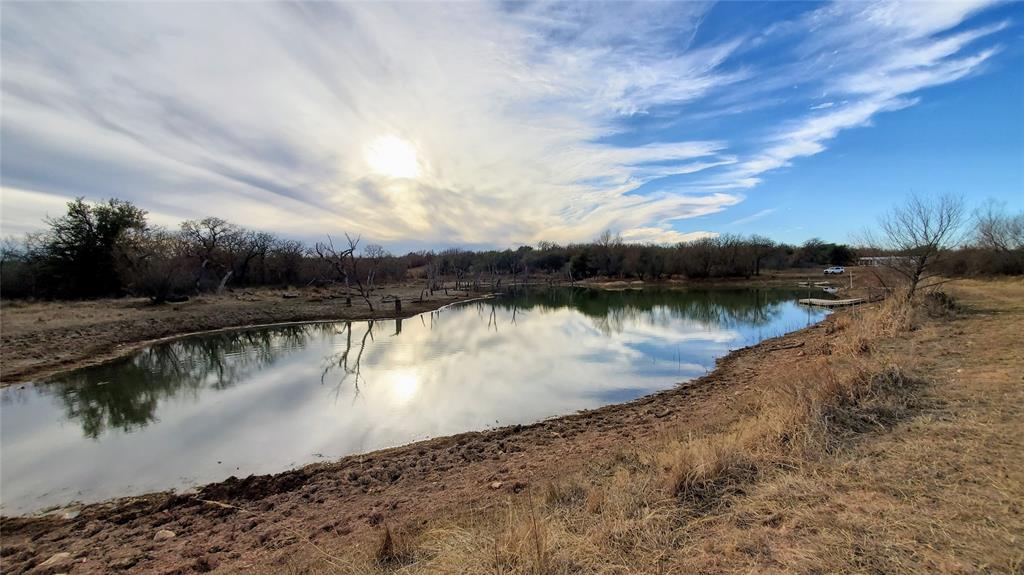 0 Co Road Gorman, TX 76454 - Photo 8 of 25 a view of a lake with houses in the back