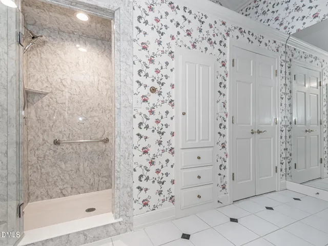 a bathroom with a bathtub and shower