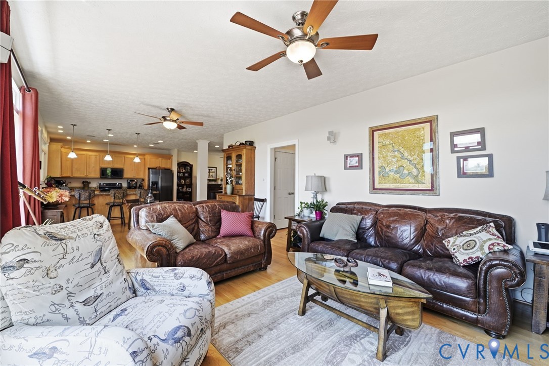 210 Riverview Road Stevensville, VA 23161 - Photo 23 of 63 Open-concept living space with wood-finish floorin
