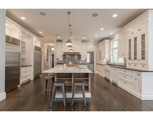 202 R Prospect Street Easton, MA 02375 - Photo 5 of 30 a kitchen with stainless steel appliances kitchen island granite countertop a table chairs sink and cabinets