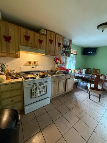 a kitchen with stainless steel appliances granite countertop a stove and a sink