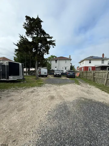 a view of a car park in front of house