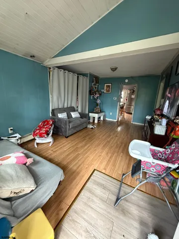 a room with furniture and a wooden floor