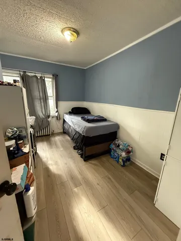 a living room with furniture gym equipment and a window