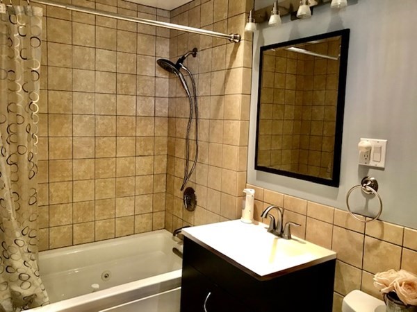 11 Vanness Road Weymouth, MA 02191 - Photo 13 of 25 a bathroom with a sink and a bathtub