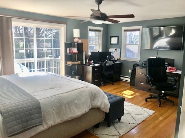 11 Vanness Road Weymouth, MA 02191 - Photo 16 of 25 a bedroom with a bed and wooden floor