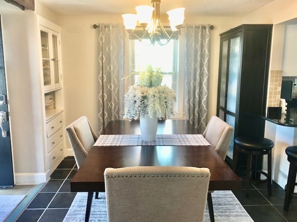 11 Vanness Road Weymouth, MA 02191 - Photo 3 of 25 a view of a dining room with furniture a potted plant and wooden floor
