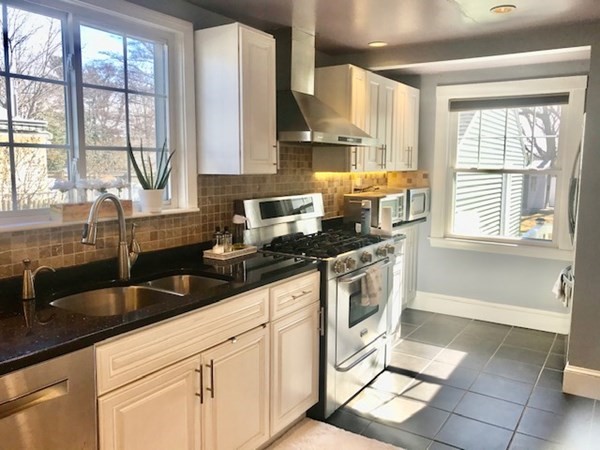 11 Vanness Road Weymouth, MA 02191 - Photo 7 of 25 a kitchen with granite countertop a sink and a stove