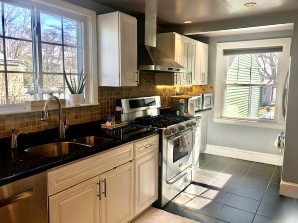 11 Vanness Road Weymouth, MA 02191 - Photo 8 of 25 a kitchen with stainless steel appliances a sink stove and cabinets