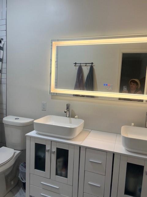 4207 Aztec Drive Dallas, TX 75216 - Photo 12 of 28 a bathroom with a sink and a toilet