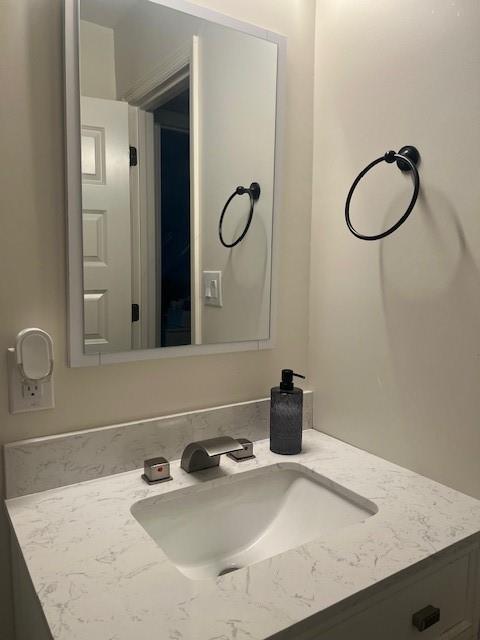 4207 Aztec Drive Dallas, TX 75216 - Photo 19 of 28 a bathroom with a sink and a mirror