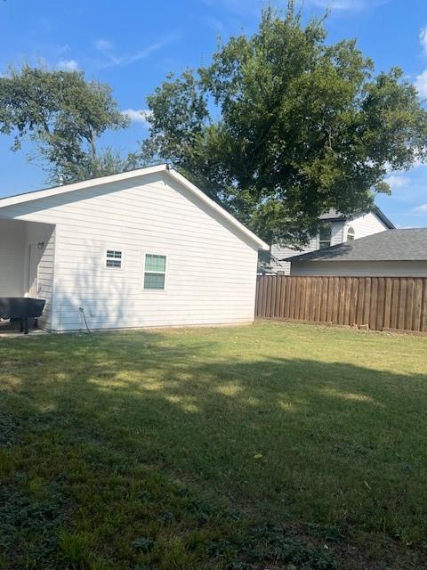 4207 Aztec Drive Dallas, TX 75216 - Photo 27 of 28 a view of a backyard with a garden