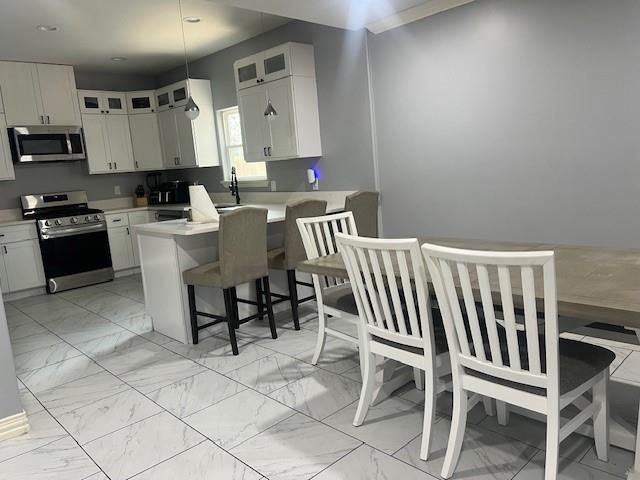 4207 Aztec Drive Dallas, TX 75216 - Photo 8 of 28 a kitchen with a chair and appliances