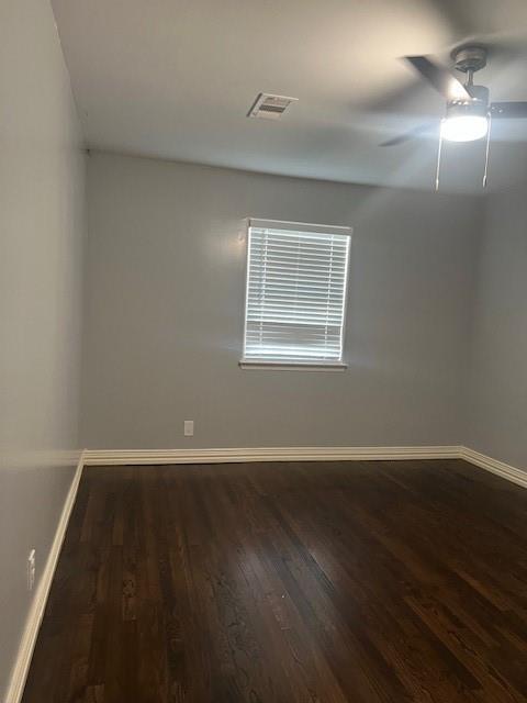 4207 Aztec Drive Dallas, TX 75216 - Photo 9 of 28 an empty room with wooden floor and windows