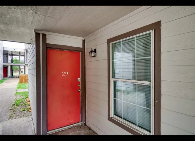a view of a livingroom with a ceiling fan and window