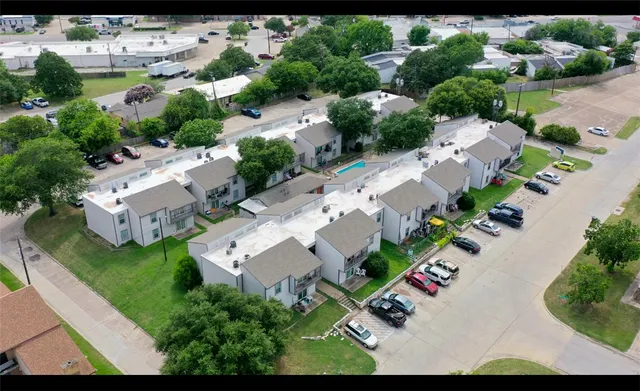 an aerial view of residential house with outdoor space
