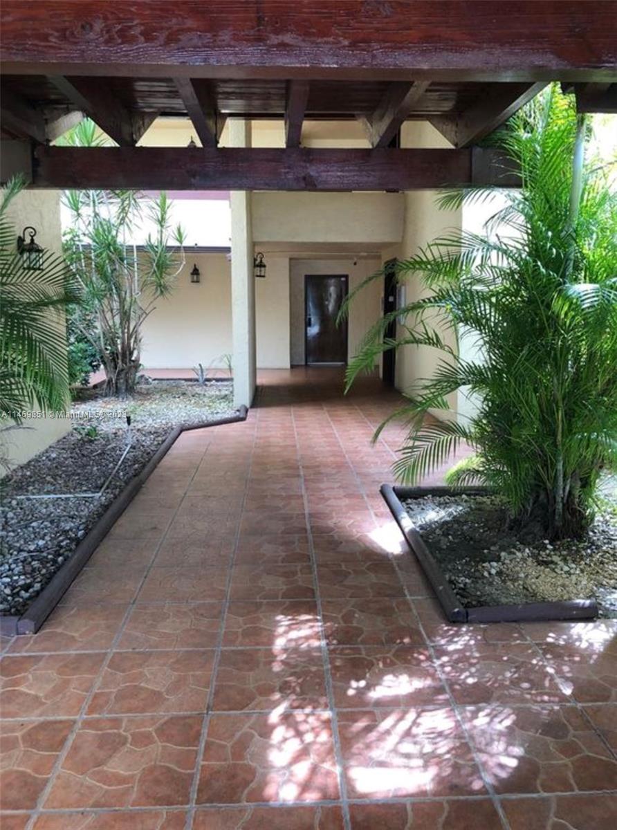 8830 Southwest 123rd Court, Unit I407 Miami, FL 33186 - Photo 3 of 18 a view of a yard with an outdoor space