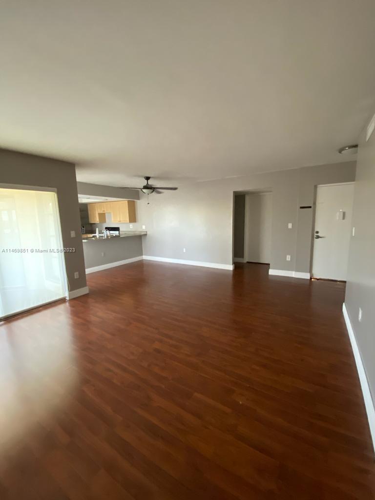 8830 Southwest 123rd Court, Unit I407 Miami, FL 33186 - Photo 5 of 18 a view of a livingroom with wooden floor