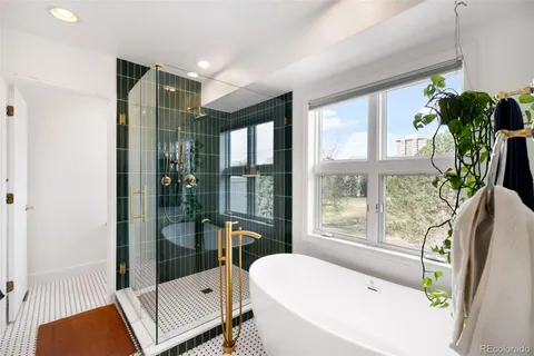 a bathroom with a tub and shower