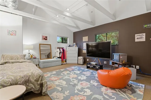 a front view of a house with yard and sitting area