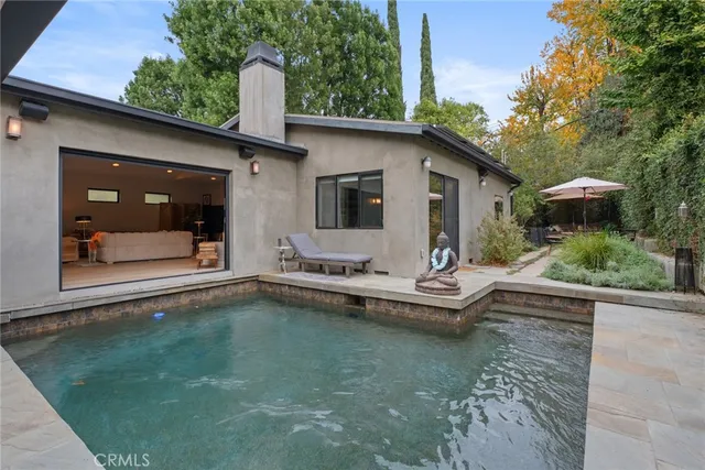 a view of balcony with wooden floor and outdoor seating