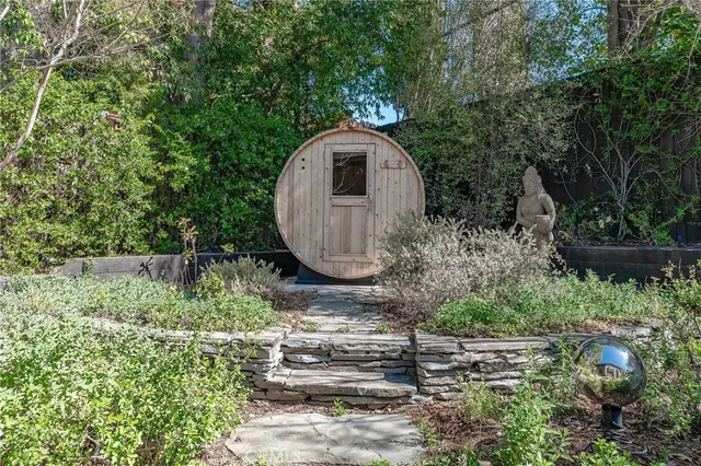 a view of a backyard with potted plants