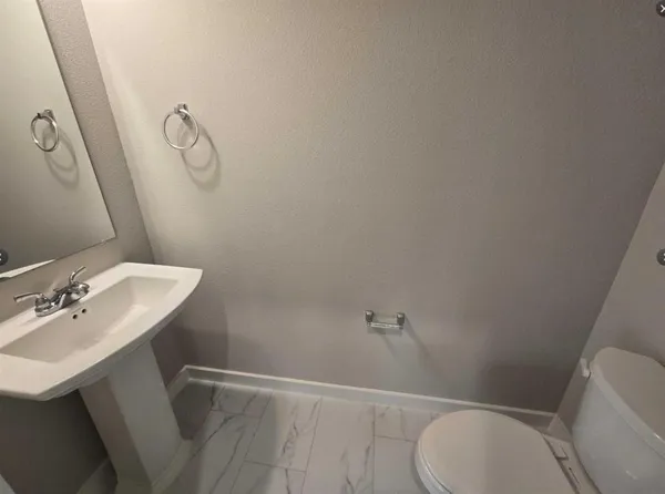 a bathroom with a sink and toilet
