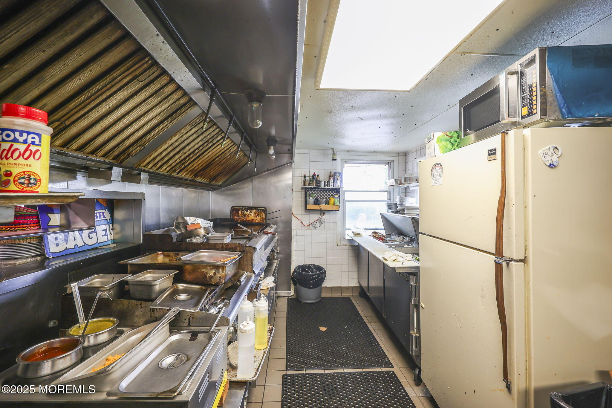 Herbertsville Road Brick, NJ 08724 - Photo 12 of 35 a kitchen with a refrigerator and a stove top oven