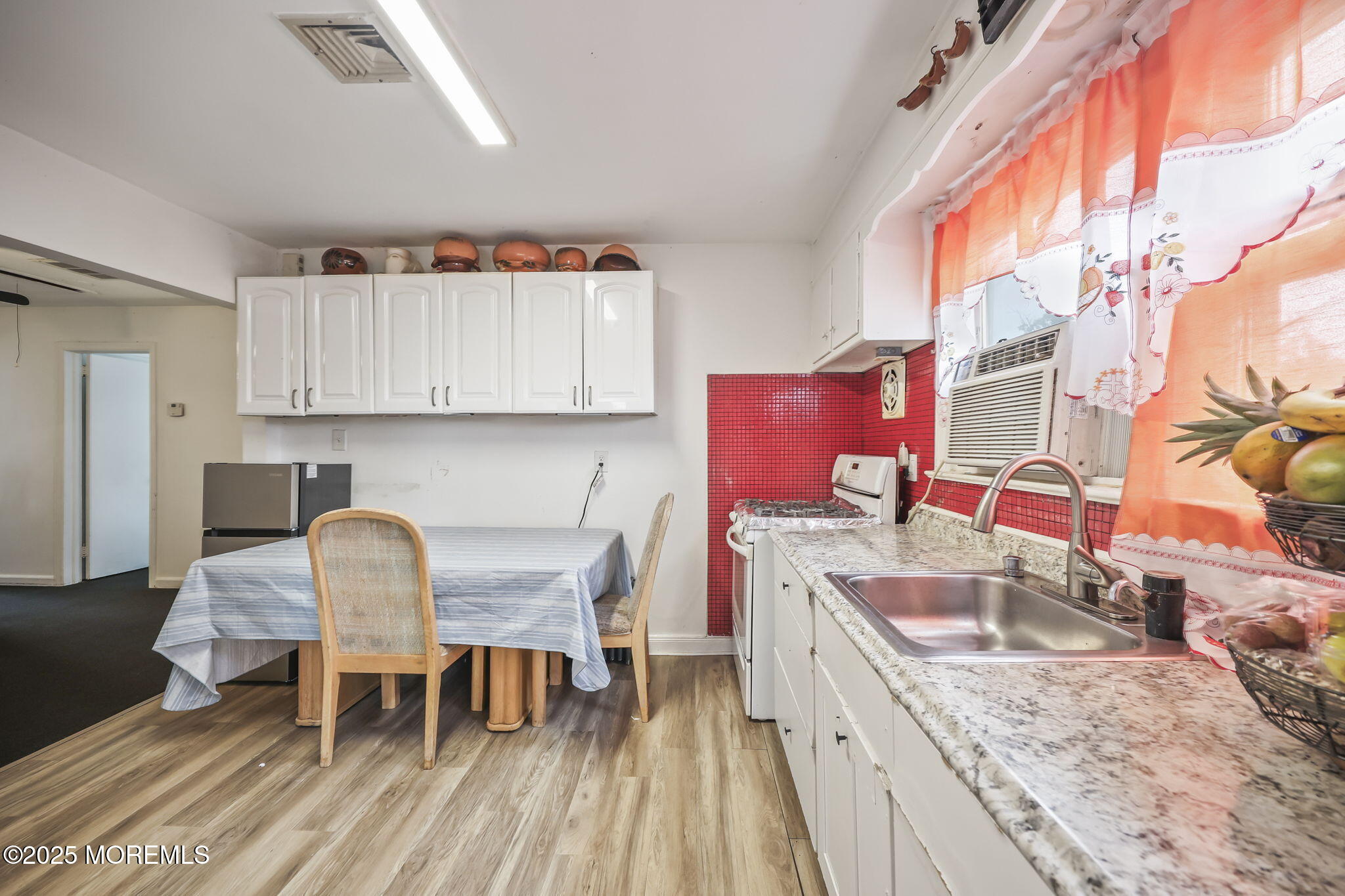 Herbertsville Road Brick, NJ 08724 - Photo 19 of 35 a kitchen with a stove a sink and a refrigerator