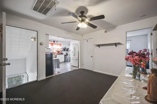 a bedroom with a flat screen television and a bed