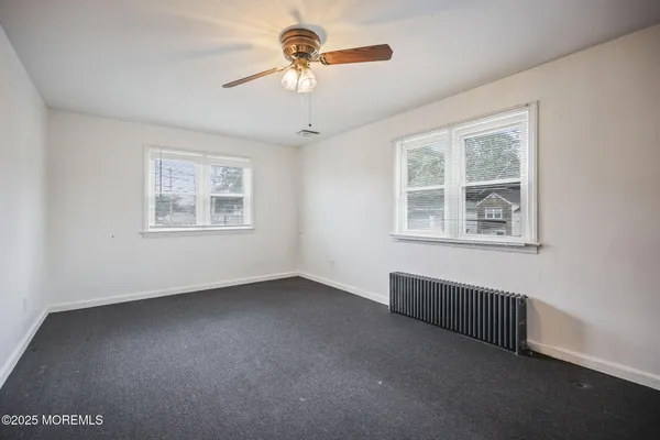 a bed room with a bed and a chair