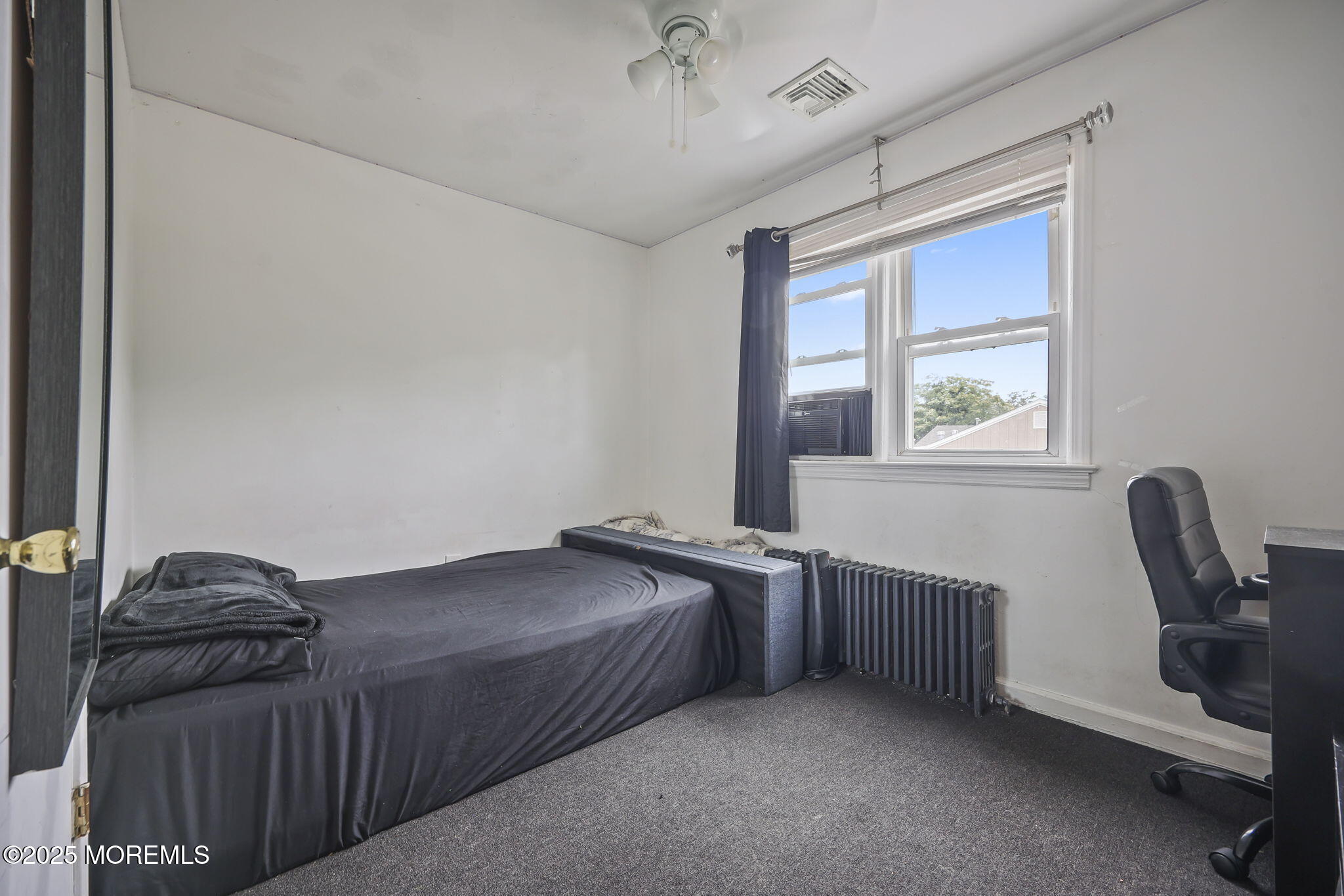 Herbertsville Road Brick, NJ 08724 - Photo 24 of 35 a bed room with a bed and a chair