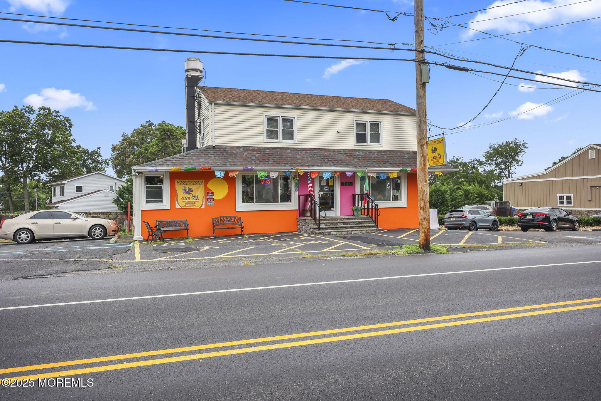 Herbertsville Road Brick, NJ 08724 - Photo 4 of 35 a view of a building with a car parked on the road