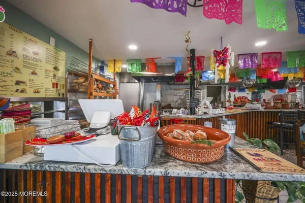a kitchen with stainless steel appliances granite countertop a refrigerator and a stove